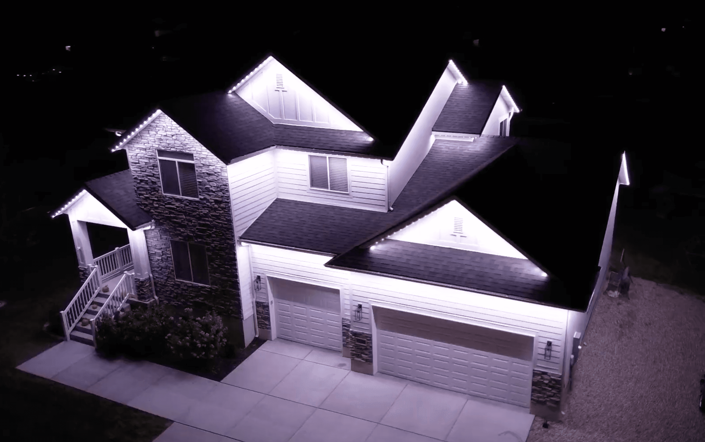 TruLight permanent LED lighting on a home during a consultation visit