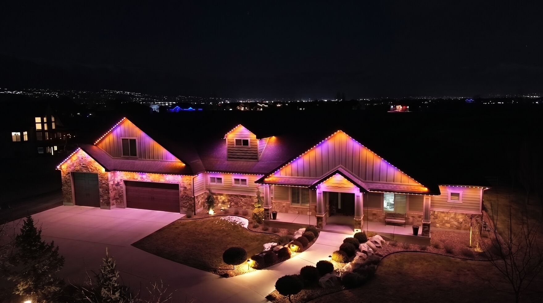Example home with permanent roofline lighting at night